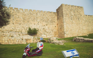 An ambucycle in front of the Old City walls in Jerusalem