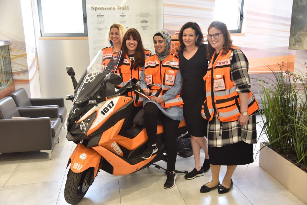 Sheryl Sandberg stands next to United Hatzalah women EMTs during a visit to the organizations headquarters in Jerusalem 1 1