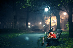 A park bench with United Hatzalah medical kit open 
