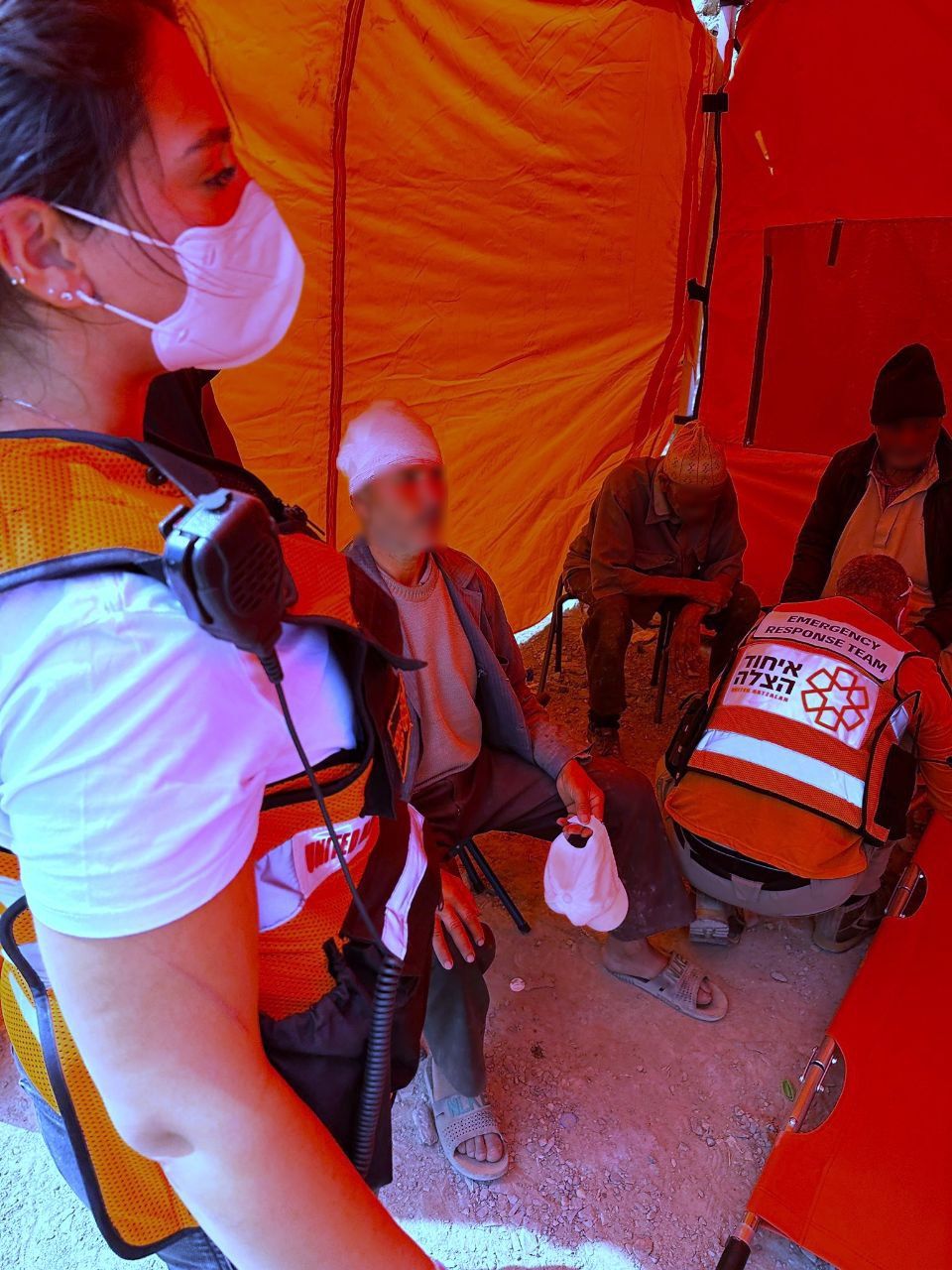 Two UH volunteers treating injured people in the medical clinic on Thursday censored 1