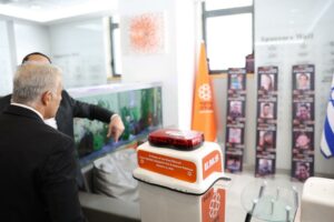 Yair Lapid in front of United Hatzalahs wall in honor of the hostages 1